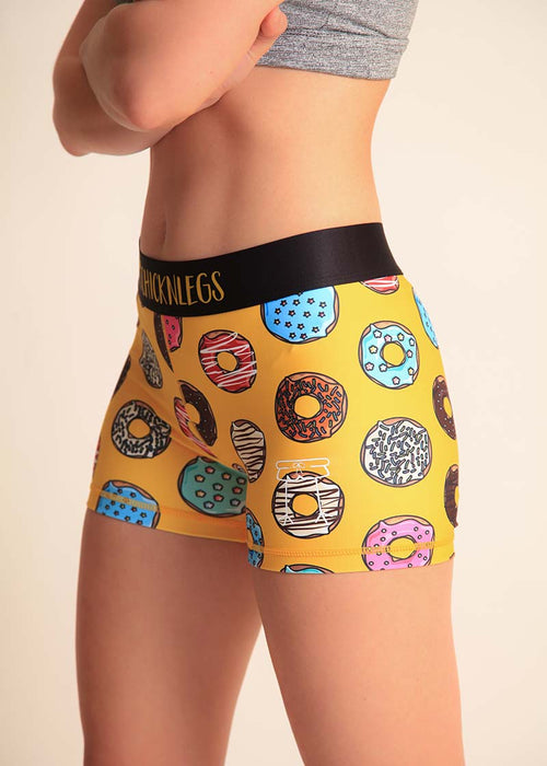 https://tcrunningco.com/cdn/shop/products/chicknlegs-womens-donuts-3-inch-compression-spandex-shorts-logo-view_500x700.jpg?v=1678394278